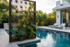 Metal trellis privacy screen as poolside divider with tropical plants and blue water